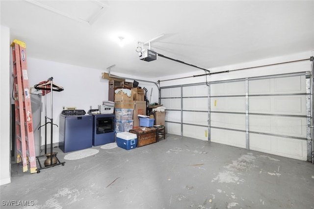 garage with a garage door opener and washer / clothes dryer