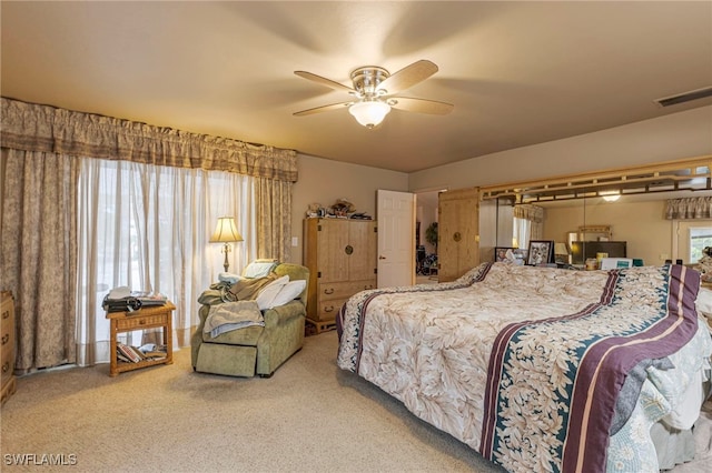 carpeted bedroom featuring ceiling fan