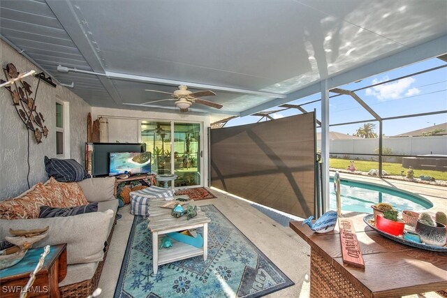 sunroom with a swimming pool and ceiling fan