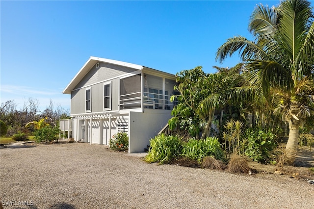 view of side of home featuring a garage