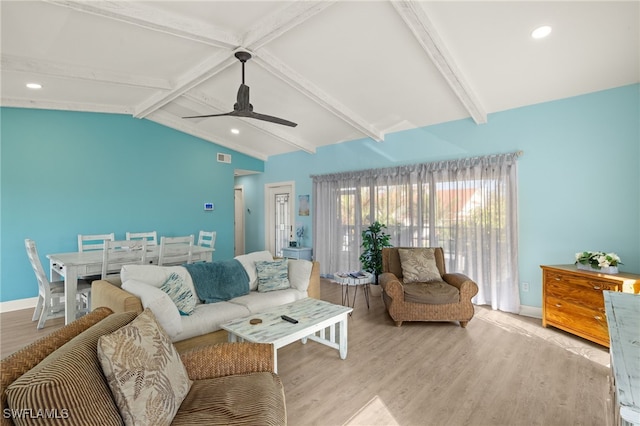 living room featuring lofted ceiling with beams, light hardwood / wood-style floors, and ceiling fan