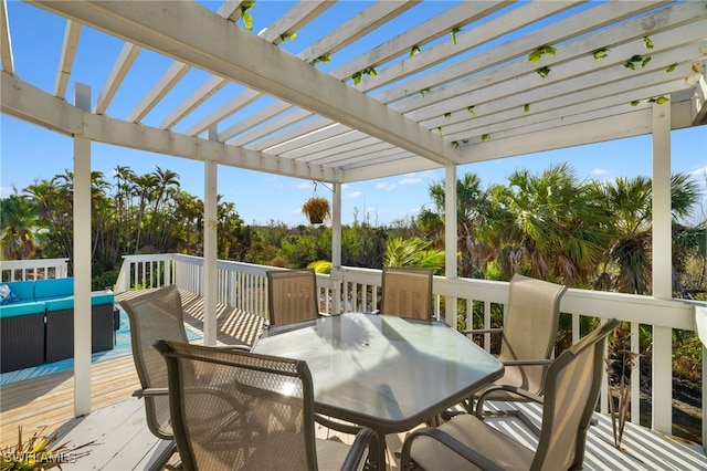 wooden terrace featuring an outdoor hangout area and a pergola