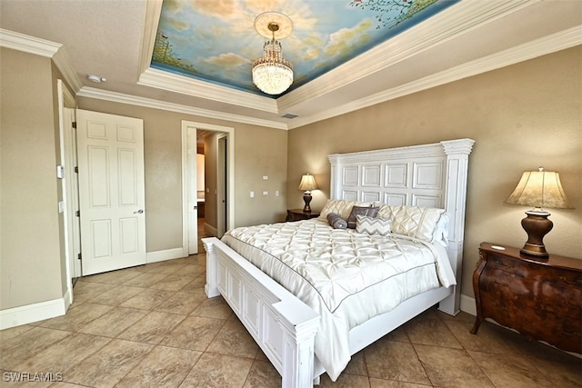 bedroom featuring ornamental molding and a tray ceiling