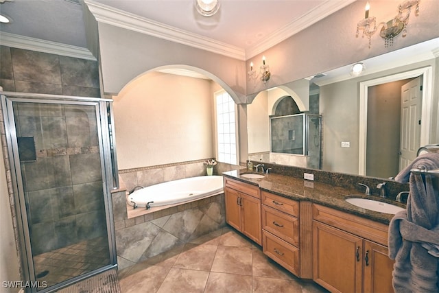 bathroom featuring vanity, crown molding, tile patterned floors, and plus walk in shower