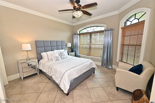 tiled bedroom with ornamental molding, multiple windows, and ceiling fan