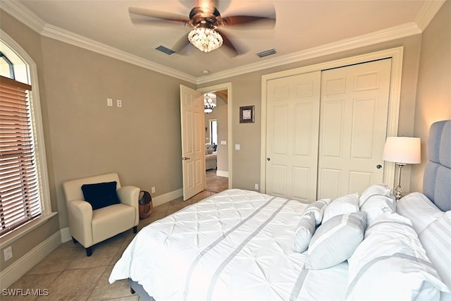 tiled bedroom featuring crown molding, a closet, and ceiling fan