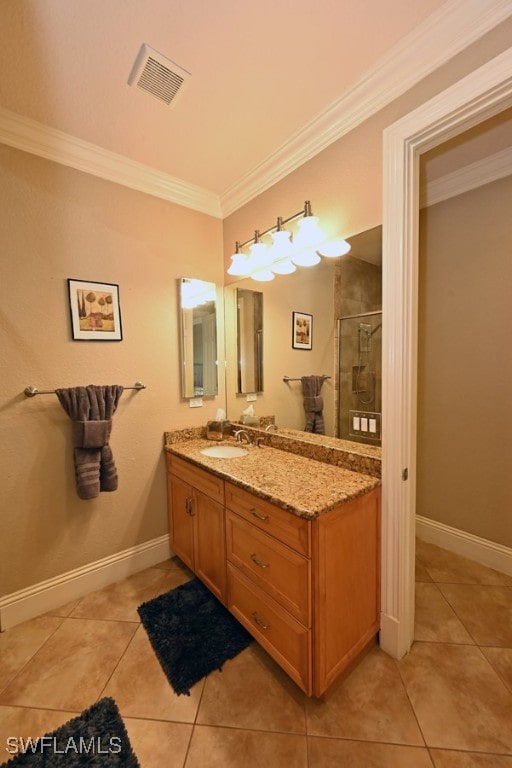 bathroom featuring vanity, tile patterned flooring, ornamental molding, and walk in shower