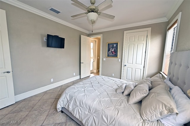 bedroom with ceiling fan, crown molding, and light tile patterned floors