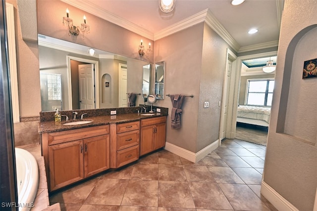 bathroom with vanity, ornamental molding, and tile patterned flooring