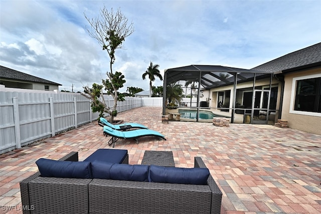 view of patio featuring a lanai and a fenced in pool