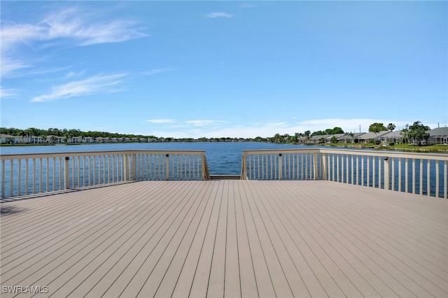 dock area featuring a deck with water view