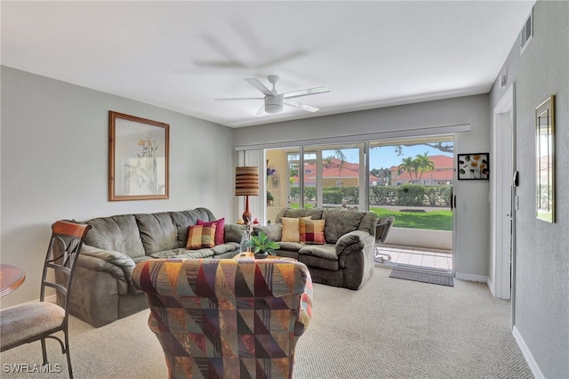 living room with light colored carpet and ceiling fan