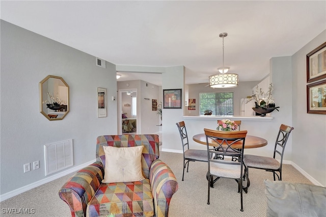 view of carpeted dining area