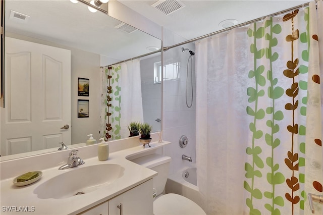 full bathroom with vanity, toilet, and shower / bath combo