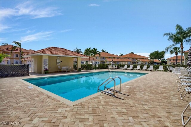 view of swimming pool with a patio