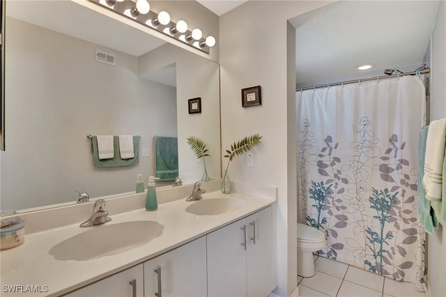 bathroom with a shower with curtain, tile patterned floors, toilet, and vanity