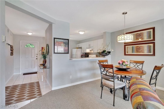 view of carpeted dining area