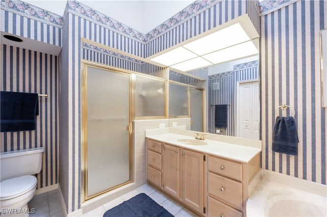 bathroom with tile patterned floors, vanity, toilet, and a shower with shower door