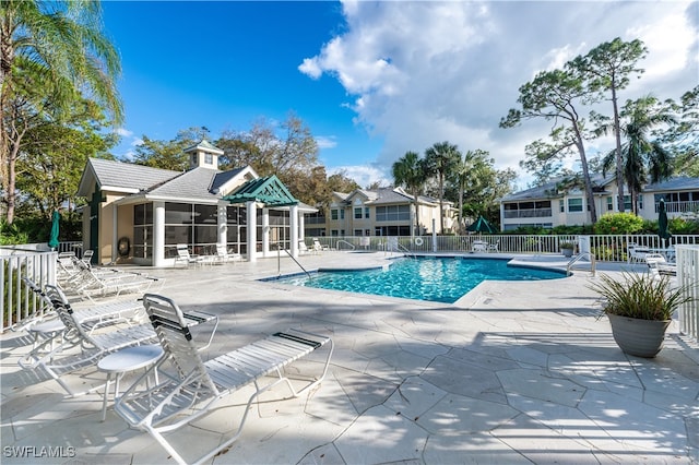 view of pool featuring a patio