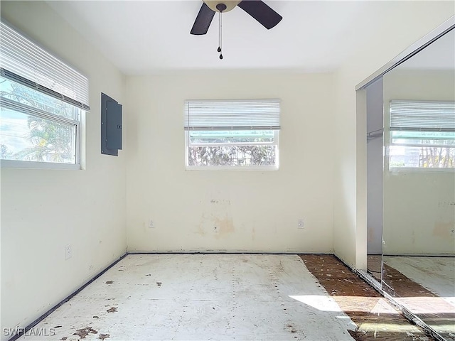 27571 Tarpon Way, Bonita Springs, FL 34134 - empty room with electric panel and a ceiling fan