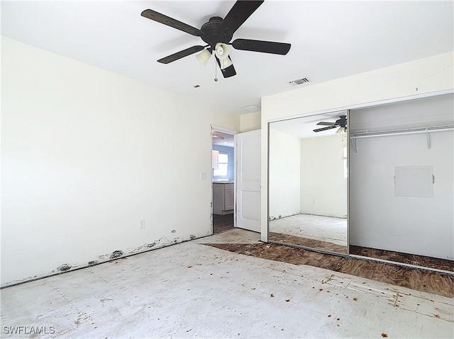 27571 Tarpon Way, Bonita Springs, FL 34134 - unfurnished bedroom featuring a closet and a ceiling fan