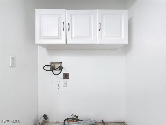 27571 Tarpon Way, Bonita Springs, FL 34134 - laundry room with electric dryer hookup, cabinet space, and washer hookup
