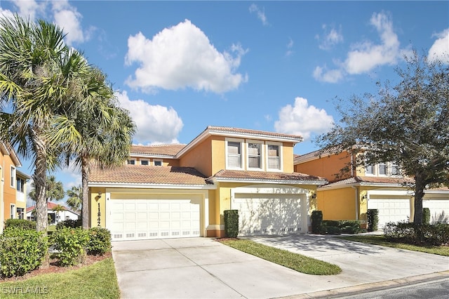 11842 Bayport Ln Unit 2104, Fort Myers, FL 33908 - view of front of property with stucco siding, a tile roof, and concrete driveway
