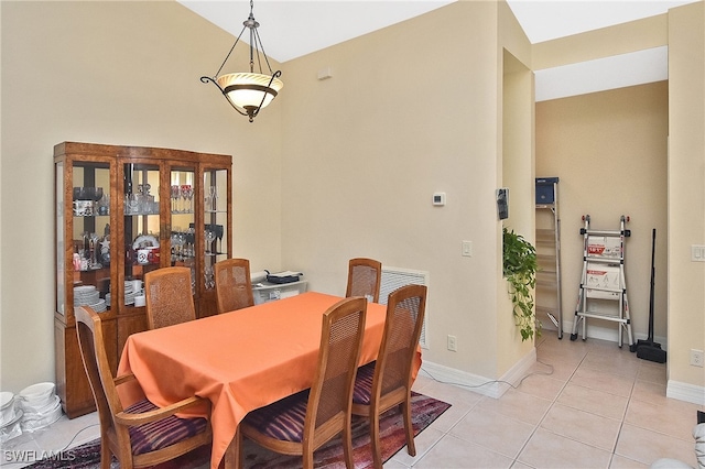 dining room with light tile patterned flooring