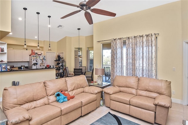 tiled living room featuring ceiling fan