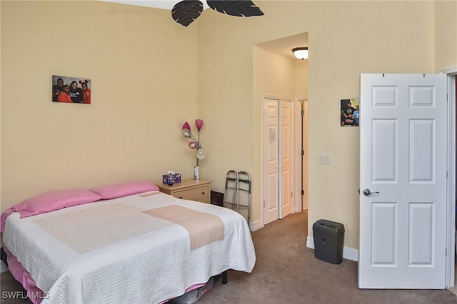 bedroom featuring a closet, carpet, and ceiling fan