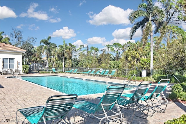 view of swimming pool with a patio