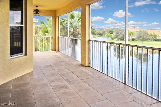 unfurnished sunroom with a water view