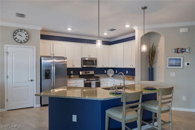 kitchen featuring sink, crown molding, pendant lighting, appliances with stainless steel finishes, and white cabinetry