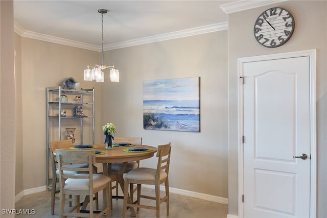 tiled dining area featuring an inviting chandelier and ornamental molding