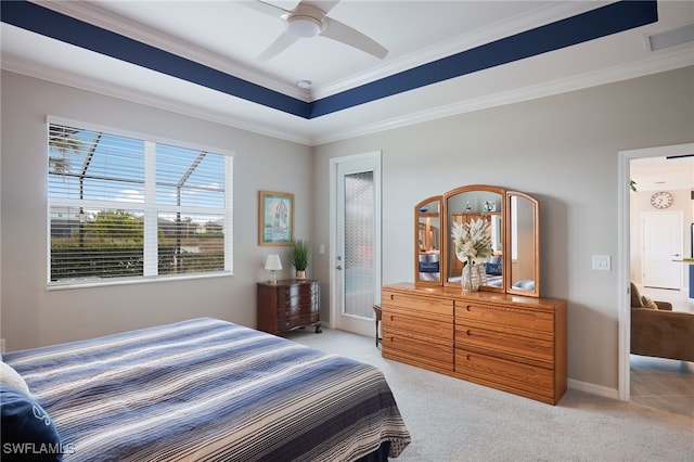 carpeted bedroom featuring ceiling fan and ornamental molding