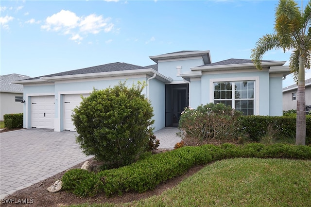 view of front of house with a garage and a front yard