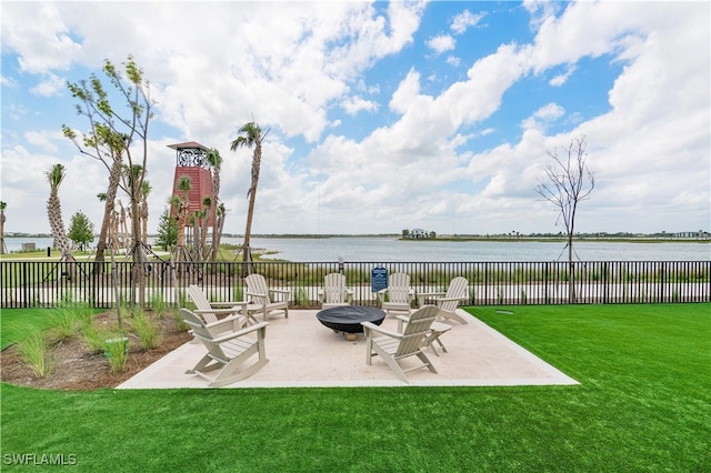 view of patio / terrace featuring a water view and an outdoor fire pit