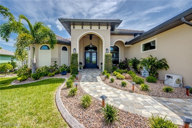 doorway to property featuring a yard