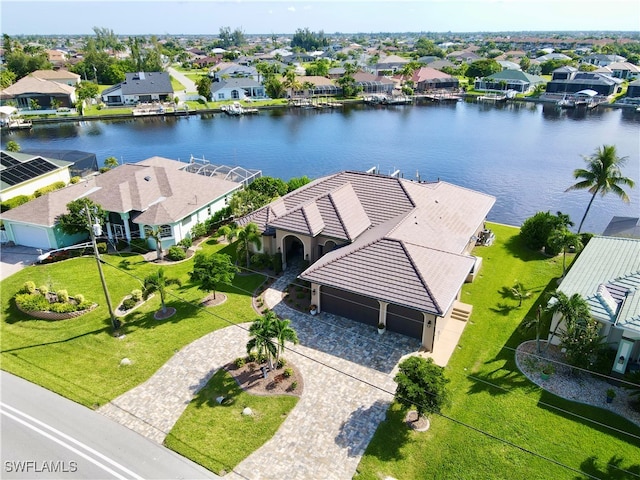 birds eye view of property with a water view