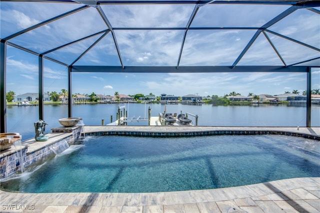 view of swimming pool with a water view, a dock, pool water feature, and a lanai