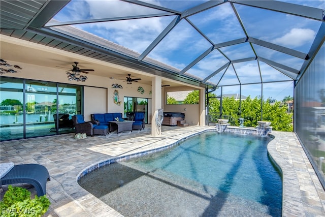 view of swimming pool featuring a patio, a lanai, an outdoor hangout area, ceiling fan, and a water view