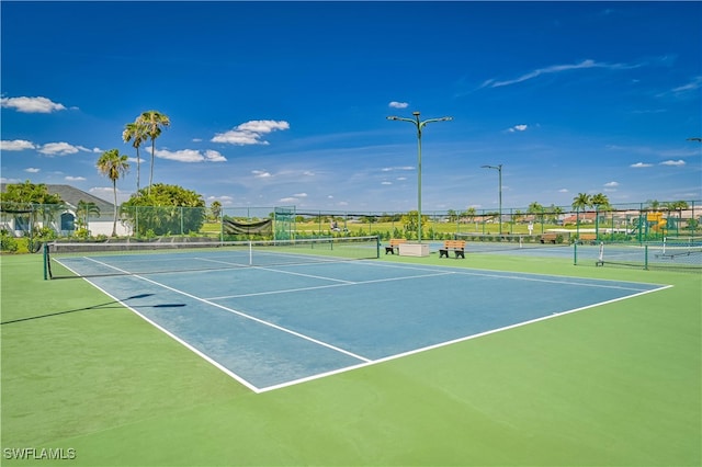 view of sport court with basketball hoop