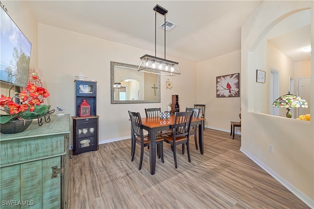 dining room featuring wood-type flooring