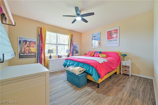 bedroom with hardwood / wood-style floors and ceiling fan