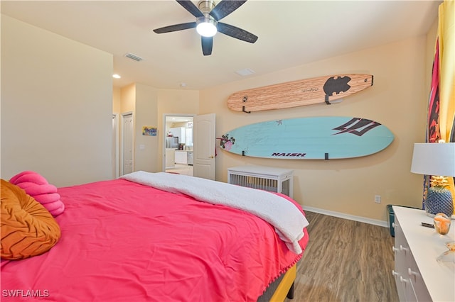 bedroom featuring hardwood / wood-style floors and ceiling fan