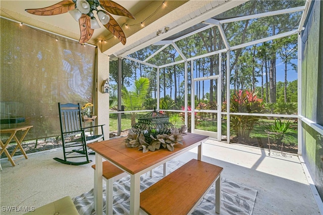 sunroom / solarium with ceiling fan