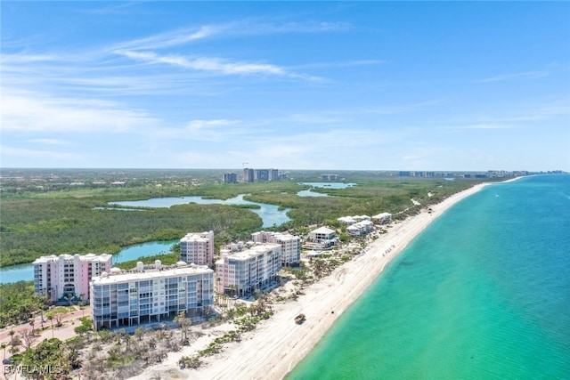 aerial view featuring a water view and a beach view