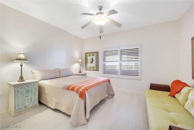 bedroom with ceiling fan and light hardwood / wood-style flooring