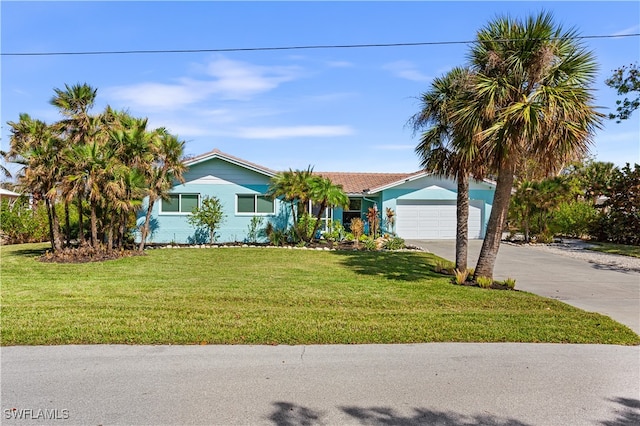 single story home with a garage and a front yard