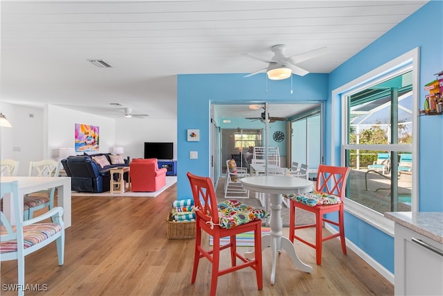 dining room featuring ceiling fan and light hardwood / wood-style flooring